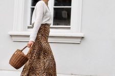 17 a white V-neck jumper, a leopard print midi, white boots and a basket as a bag are amazing for a girlish fall look