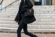 18 a total black look with a sweater, a blazer, skinnies, tall chunky Chelsea boots and a bag