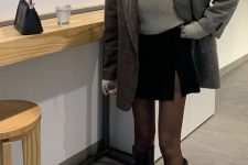 19 a fall outfit with a grey turtleneck, an oversized grey blazer, a black mini skirt, black knee boots and a small bag