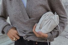 21 a casual work look with a white top, a grey lapel sweater, black jeans and a neutral bag