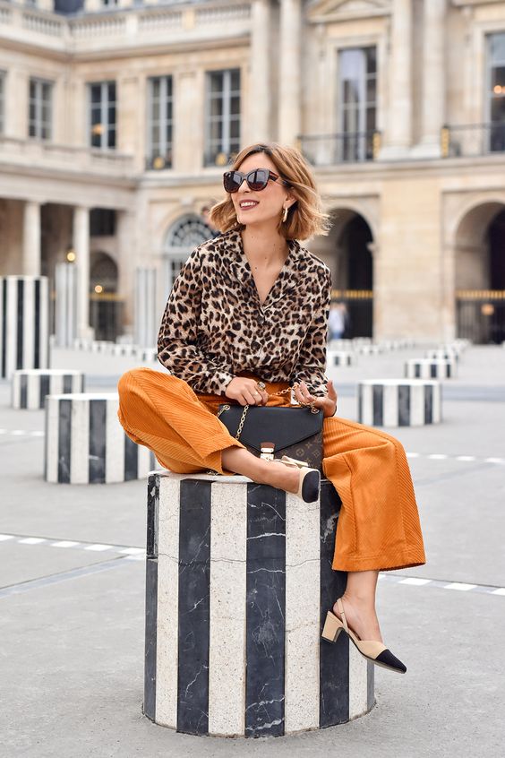 a leopard print blouse, mellow yellow pants, two tone slingbacks and a black pritned bag for an elegant fall look
