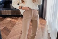 23 a neutral work look with a creamy lapel sweater, beige pants, beige lace up boots and a necklace is cozy and cool