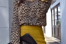 23 a refined fall outfit with a leopard print top, a mustard pencil skirt, a chain necklace, a black bag with chain and a bracelet with a watch
