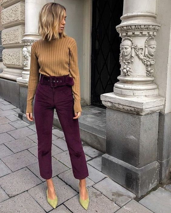 a chic and bold fall work look with a beige ribbed turtleneck, deep purple cropped pants, neon green velvet shoes is wow