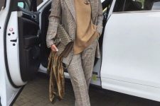 24 a tan turtleneck, a grey plaid pantsuit, green shoes and a printed bag create a chic and refined fall work look