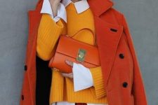 25 a bold fall work look with a white shirt, a yellow jumper, red leather pants, an orange coat and an orange bag