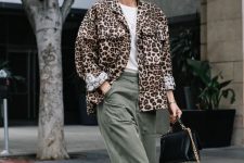 25 a white t-shirt, a leopard print blazer, olive green jeans, white boots and a black bag with chain for the fall