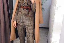 25 an elegant and formal fall work outfit with a grey plaid pantsuit, a brown belt, burgundy boots, a camel coat