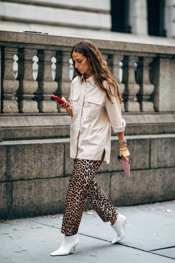 an oversized neutral shirt, leopard print trousers, white ankle kitten heel booties for a lovely fall look