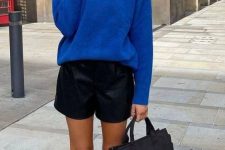 28 a bold fall look with an electric blue sweater, black leather shorts, black knee chunky boots and a black tote