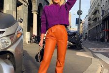 28 a jewel-tone fall work outfit with a purple cropped sweater, orange leather pants, hot pink shoes and a black bag with chain