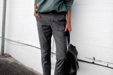 29 an olive green sweatshirt, cropped grey trousers, black slipons and a black backpack for the fall