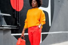 32 a yellow ribbed jumper, red pants, amber shoes and a bold red bag are a nice combo for the fall