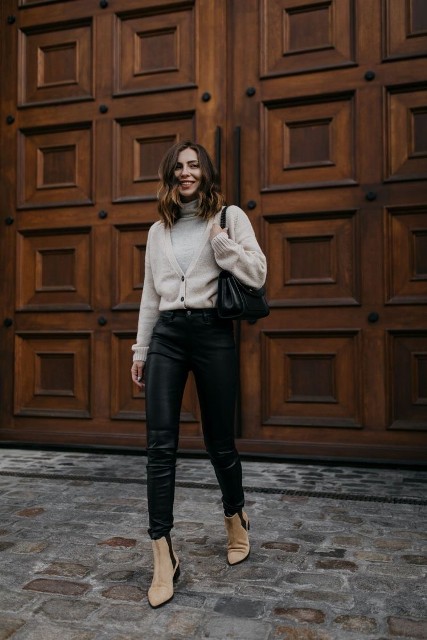 With black leather bag, black leather skinny pants and beige and black suede low heeled ankle boots