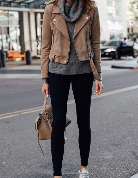 With black leggings, white and gray sneakers and beige leather tote bag