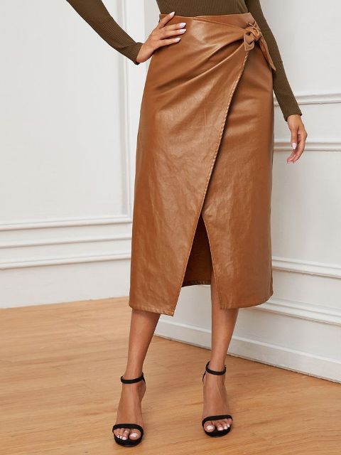 With brown long sleeved fitted shirt and black ankle strap high heels