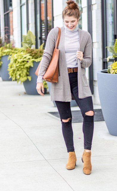 With distressed skinny jeans, brown leather belt, brown leather tote bag and brown suede low heeled boots