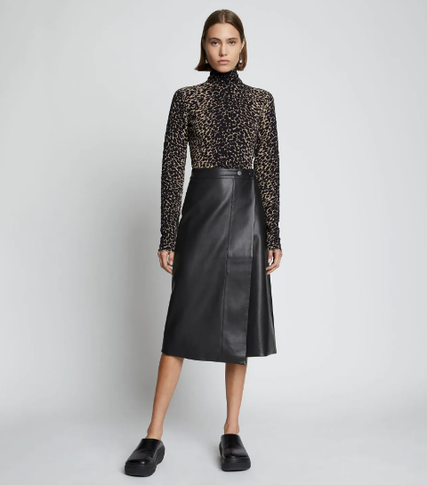 With leopard printed fitted turtleneck and black leather shoes