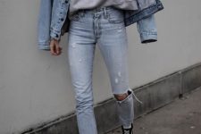 With light blue distressed jeans, white socks and black and white sneakers