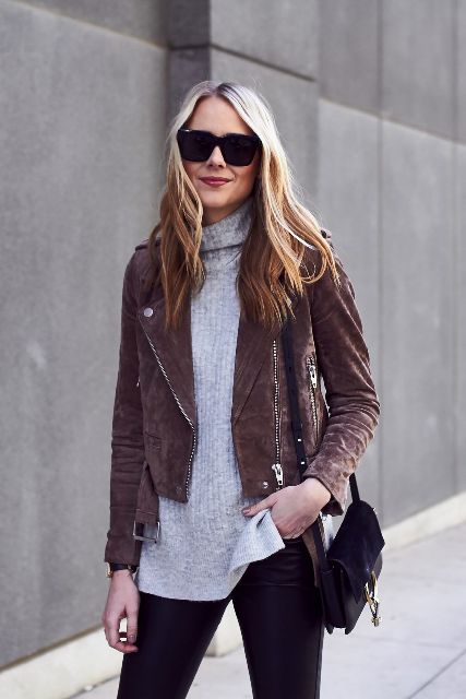 With oversized sunglasses, black leather skinny pants and black leather and suede bag