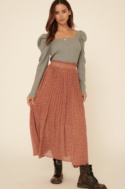 With printed high-waisted pleated maxi skirt, necklace and brown leather lace up flat boots