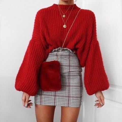 With red loose bell sleeved sweater, necklace and gray and red checked high waisted mini skirt