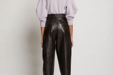 With rounded earrings, dark brown leather high-waisted cuffed trousers and black leather high heels