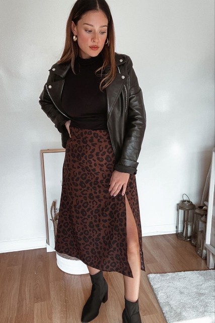 With silver earrings, leopard printed midi skirt and black low heeled ankle boots