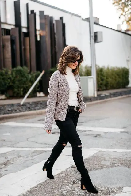 With sunglasses, black distressed skinny jeans, black belt and black suede heeled ankle boots