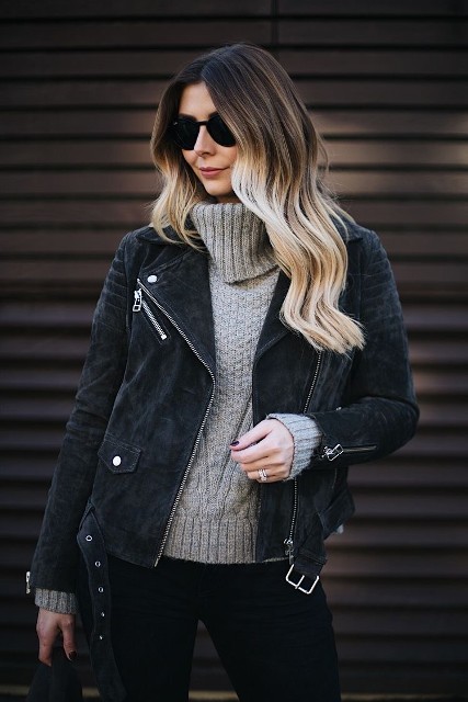 With sunglasses, black skinny jeans and black bag