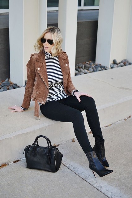 With sunglasses, black skinny pants, black leather mid calf high heeled boots and black leather bag