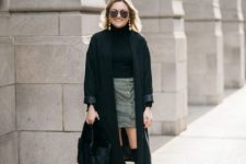 With sunglasses, golden earrings, gray high-waisted button front mini skirt, black faux fur bag and black over the knee boots