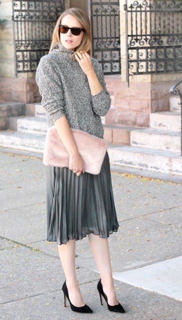 With sunglasses, gray loose turtleneck sweater, gray pleated midi skirt and black pumps