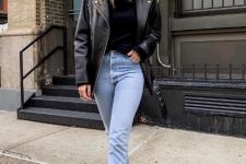 With sunglasses, light blue cropped jeans and black leather mid calf boots