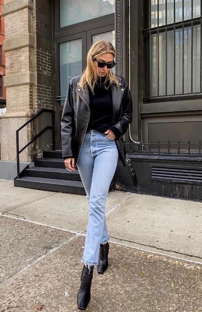 With sunglasses, light blue cropped jeans and black leather mid calf boots