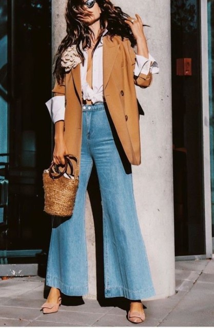 With sunglasses, white crop shirt, brown long blazer, beige straw bag and pale pink suede shoes