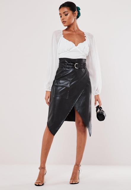 With white blouse, earrings, black leather mini bag and beige ankle strap high heels
