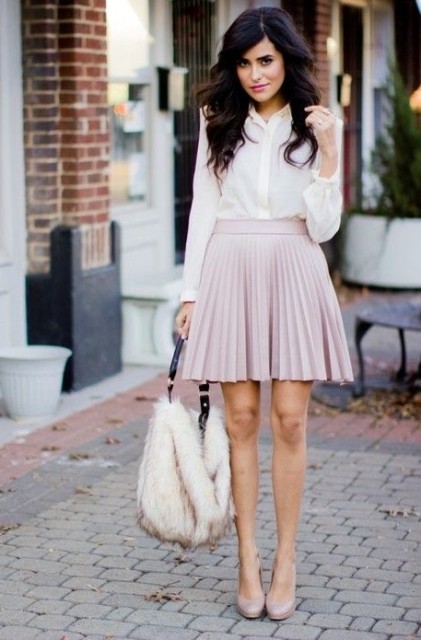 With white button down blouse, pale pink pleated mini skirt and pale pink leather high heeled shoes