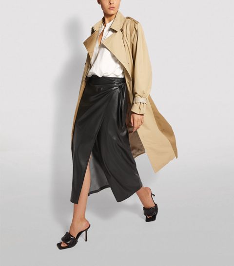 With white loose blouse, beige midi trench coat and black leather heeled mules