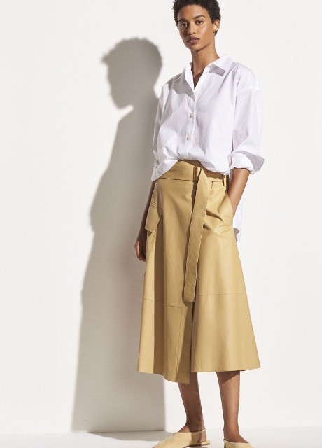 With white loose button down shirt and beige leather flat shoes