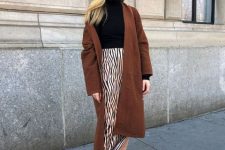 With zebra printed high-waisted midi skirt and beige suede lace up mid calf boots