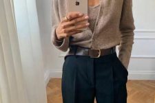 a beige knit co-ord, black trousers, a brown belt are an amazing work combo for any cold day