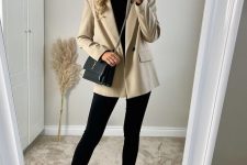 a black turtleneck, black skinnies, a creamy blazer and creamy Chelsea boots plus a chic bag for work this fall