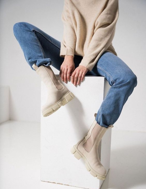 a casual look with a tan sweater, blue jeans, creamy Chelsea boots   you won't need more for a comfy outfit