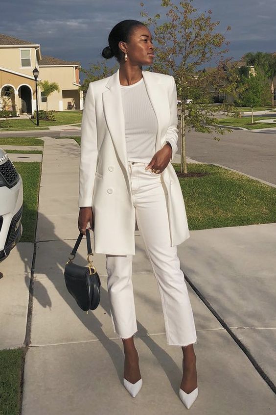 a chic and lovely all-white fall work outfit with a t-shirt, cropped jeans, an oversized blazer, pointed toe shoes and a black bag