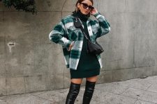 a dark grene turtleneck sweater dress, a plaid shirt jacket, black over the knee boots and a small black bag