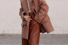 a greige t-shirt, brown leather culottes, a red plaid oversized blazer, white strappy shoes for a chic fall work look