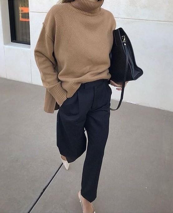 a minimalist fall outfit with a beige turtleneck sweater, navy pants, creamy slingbacks and a large black bag for work