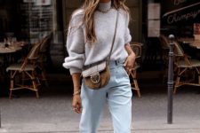 a neutral fall look with a grey oversized sweater, light blue jeans, brown shoes and a brown saddle bag
