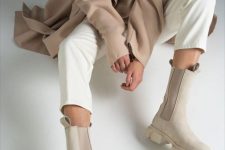 a neutral fall outfit with a beige jumper and trench, white jeans and nude Chelsea boots is amazing